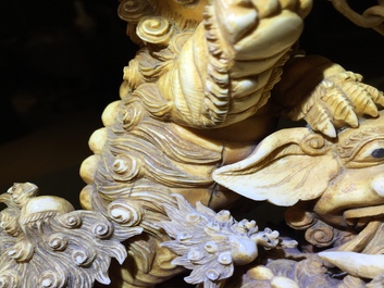 A Chinese carved ivory group of Buddhist lions playing with a ball, 19/20th C.