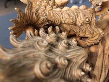 A Chinese carved ivory group of Buddhist lions playing with a ball, 19/20th C.