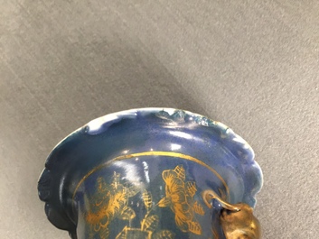 Three Chinese famille verte on gilt blue-ground vases, 19th C.