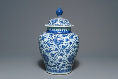 A tall Chinese blue and white 'lotus scroll' vase and cover, Kangxi