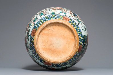 A Chinese famille verte fish bowl with warriors, 19th C.