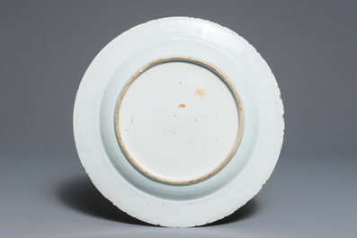 A Chinese famille rose "Eight Immortals" charger with a central landscape, Qianlong