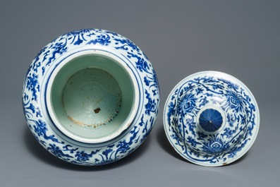 A tall Chinese blue and white 'lotus scroll' vase and cover, Kangxi