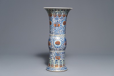 A clobbered Chinese blue and white 'gu' beaker vase, Kangxi
