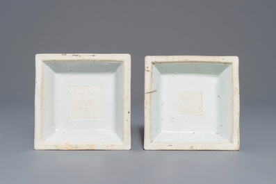 A pair of clobbered Chinese blue and white candlesticks, Kangxi