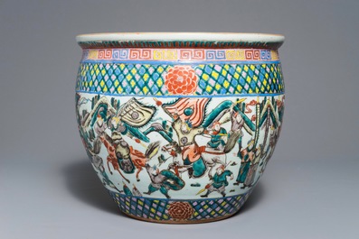 A Chinese famille verte fish bowl with warriors, 19th C.