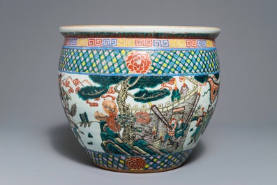 A Chinese famille verte fish bowl with warriors, 19th C.