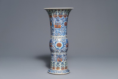 A clobbered Chinese blue and white 'gu' beaker vase, Kangxi