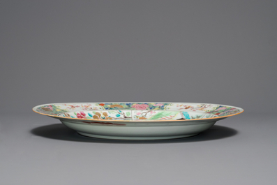 A fine Chinese famille rose dish with figures in a garden, Yongzheng
