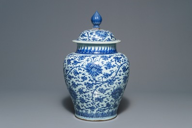 A tall Chinese blue and white 'lotus scroll' vase and cover, Kangxi