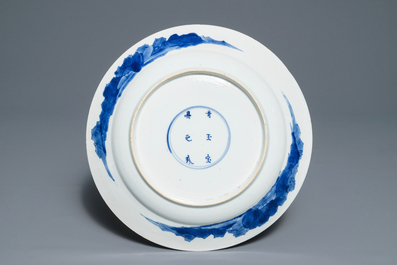 A Chinese blue and white dish with long Eliza playing music, Kangxi