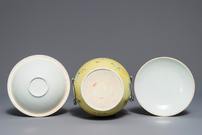 A Chinese famille rose yellow ground sgraffiato bowl and cover, 19/20th C.