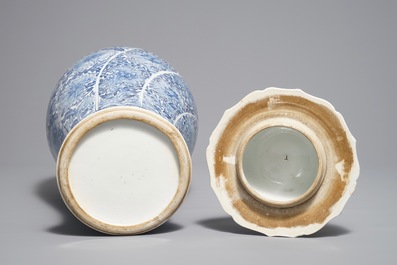 A Chinese blue and white moulded vase and cover with floral design, Kangxi