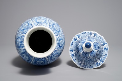 A Chinese blue and white moulded vase and cover with floral design, Kangxi