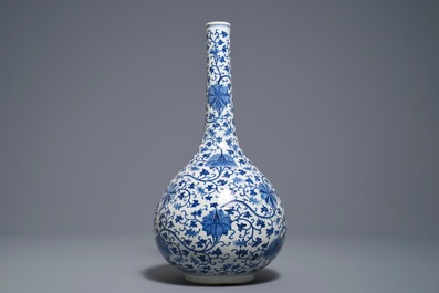 A Chinese blue and white 'lotus scroll' bottle vase, 18/19th C.