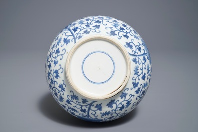 A Chinese blue and white 'lotus scroll' bottle vase, 18/19th C.