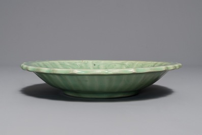 A Chinese Longquan celadon dish with underglaze design, Ming