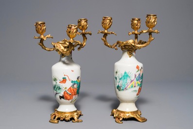 Une paire de vases en porcelaine de Chine famille rose mont&eacute;s comme candelabres, Yongzheng
