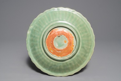A Chinese Longquan celadon dish with underglaze design, Ming