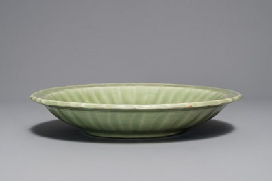 A Chinese Longquan celadon dish with underglaze design, Ming