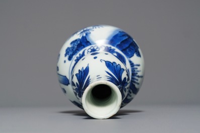 A Chinese blue and white double gourd vase with figures in a landscape, Transitional period