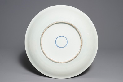 A massive Chinese famille verte dish with figures in a landscape, 19th C.