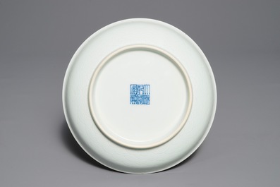 A pair of Chinese pale celadon anhua-decorated plates, Qianlong mark, 19/20th C