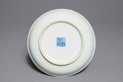 A pair of Chinese pale celadon anhua-decorated plates, Qianlong mark, 19/20th C