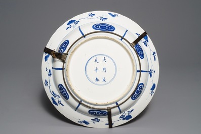 A Chinese blue and white charger with fighting horseriders, Chenghua mark, Kangxi