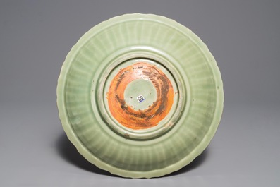 A Chinese Longquan celadon dish with underglaze design, Ming