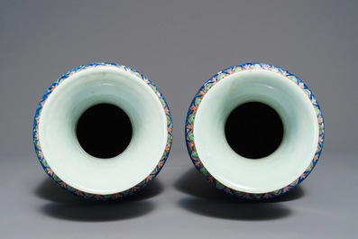 A pair of Chinese famille rose rouleau vases, 19th C.