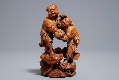 A Chinese carved bamboo group of two playing boys, 19/20th C.