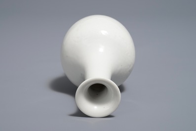 A Chinese blanc de Chine bottle vase with incised anhua design, ca. 1900