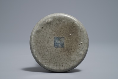 A Chinese crackle-glazed round scroll weight, Qianlong mark, 19/20th C.