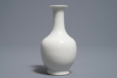 A Chinese blanc de Chine bottle vase with incised anhua design, ca. 1900