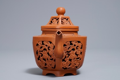 A Chinese reticulated double-walled Yixing stoneware teapot and cover, Kangxi