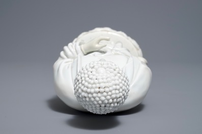 A Chinese Dehua blanc de Chine model of a standing Buddha, impressed mark on the back, Kangxi