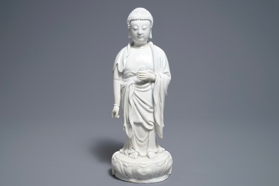 A Chinese Dehua blanc de Chine model of a standing Buddha, impressed mark on the back, Kangxi