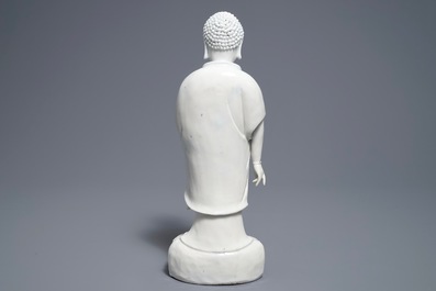A Chinese Dehua blanc de Chine model of a standing Buddha, impressed mark on the back, Kangxi