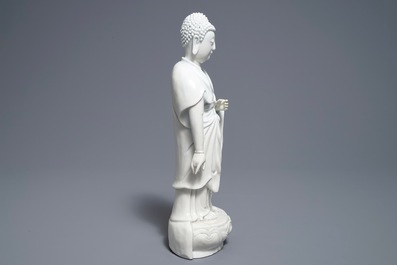 A Chinese Dehua blanc de Chine model of a standing Buddha, impressed mark on the back, Kangxi