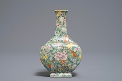 A Chinese eggshell famille rose millefleurs vase on stand, Qianlong mark, 18/19th C.