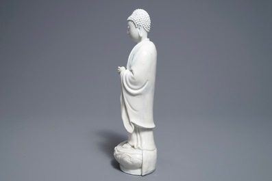 A Chinese Dehua blanc de Chine model of a standing Buddha, impressed mark on the back, Kangxi