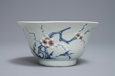 A Chinese blue, white and red on celadon ground 'prunus' bowl, Kangxi