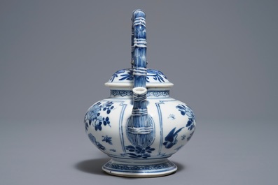 A Chinese blue and white gate-handled teapot and cover, Kangxi