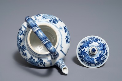 A Chinese blue and white gate-handled teapot and cover, Kangxi