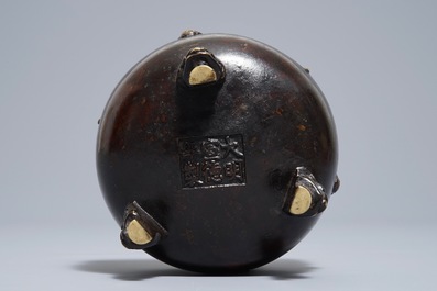 A Chinese bronze tripod incense burner, Xuande mark, 19th C.