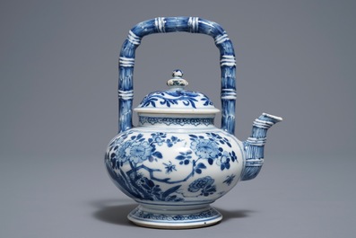 A Chinese blue and white gate-handled teapot and cover, Kangxi