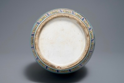 A Chinese famille rose turquoise ground vase, 19th C.