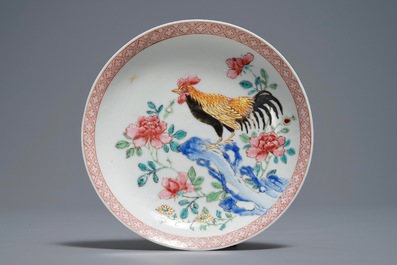 A Chinese famille rose cup and saucer with roosters, Yongzheng
