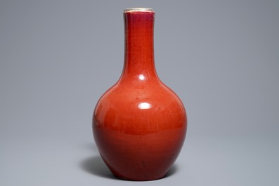 A Chinese monochrome oxblood-glazed bottle vase, 19th C.